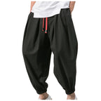 Men's loose linen harem pants by Nova Mart, featuring an oversized fit and relaxed style, displayed on a model.