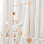 Baby wooden crib mobile with cloud-shaped hanging rattle toy and bracket, designed for infant cribs by Nova Mart.