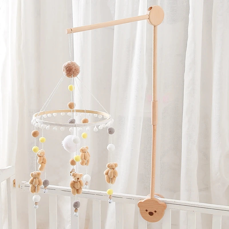 Baby wooden crib mobile with cloud-shaped hanging rattle toy and bracket, designed for infant cribs by Nova Mart.
