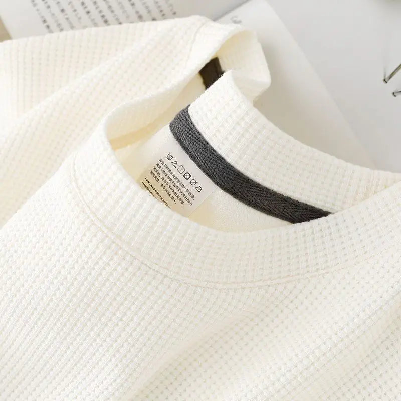 Unisex waffle knit T-shirt in solid color, casual and loose fit, men's fashion by Nova Mart, shown in the image.