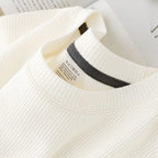 Unisex waffle knit T-shirt in solid color, casual and loose fit, men's fashion by Nova Mart, shown in the image.