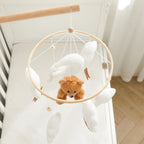 Wooden baby crib mobile by Nova Mart featuring soft felt cartoon bear and a music box for calming nursery decor.