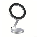 Adjustable magnetic car phone holder from Nova Mart mounted on a vehicle dashboard with a smartphone attached.
