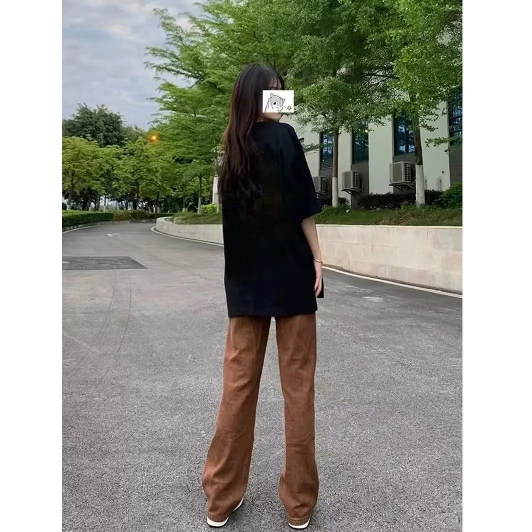 Brown straight-leg denim jeans by Nova Mart with a classic American retro style, shown on a model.