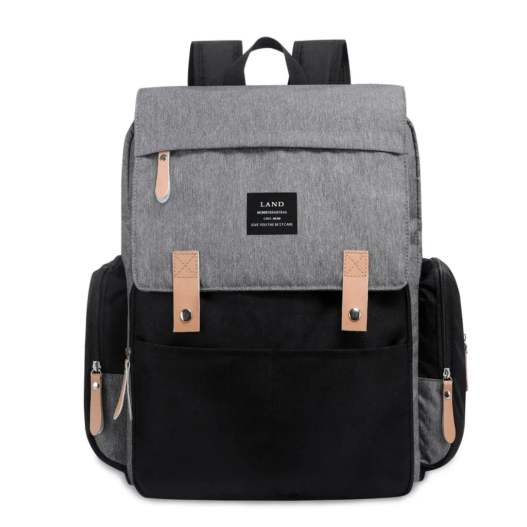 Nova Mart denim diaper bag backpack with thermal bottle pocket, stylish and functional baby diaper bag with multiple compartments.