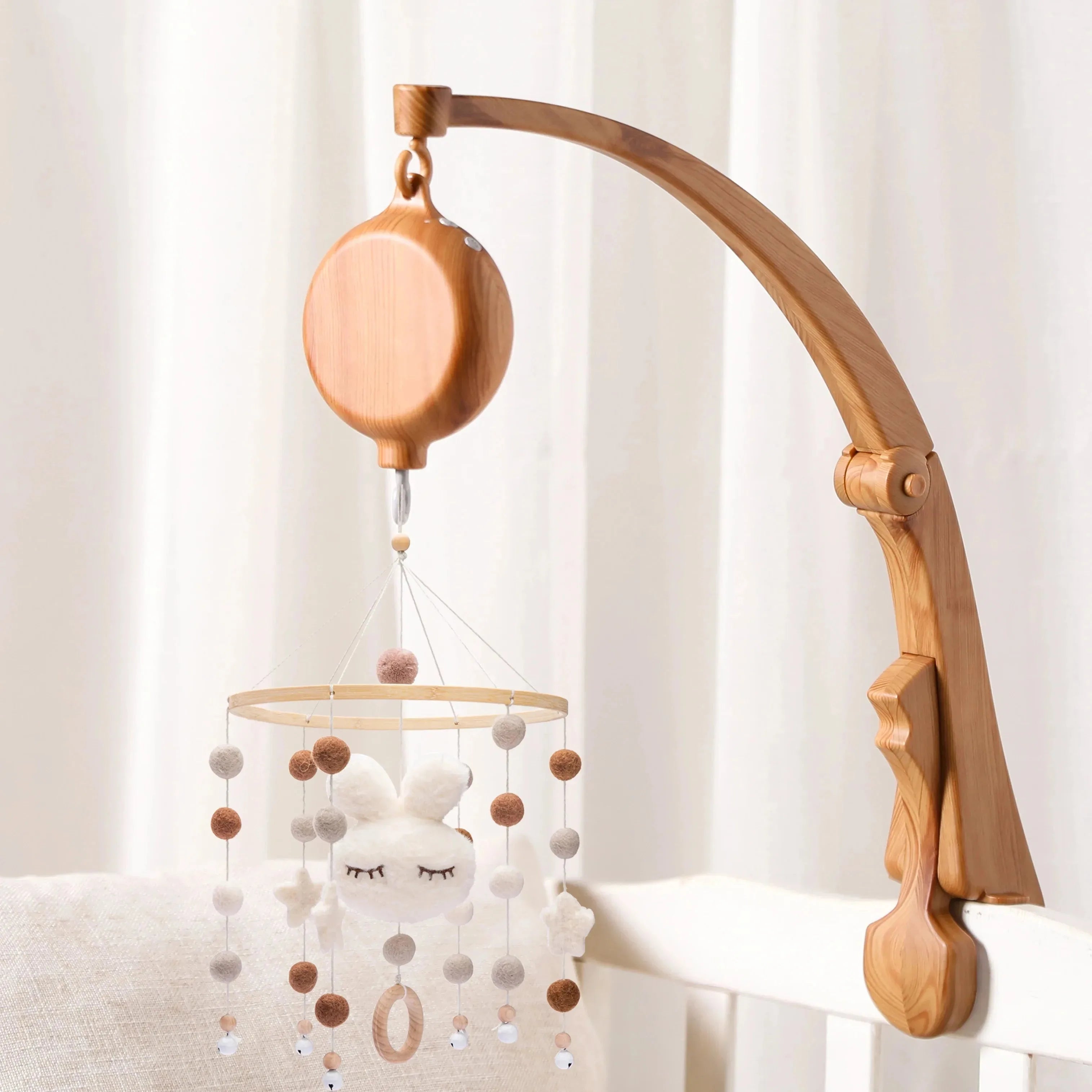 Nova Mart DIY baby crib bed bell holder arm with rotating music box, featuring colorful baby toy and easy-to-attach design.