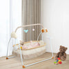 Electric baby cradle with music and remote control, foldable bassinet from Nova Mart, featuring a soft, cozy sleeping environment for infants.