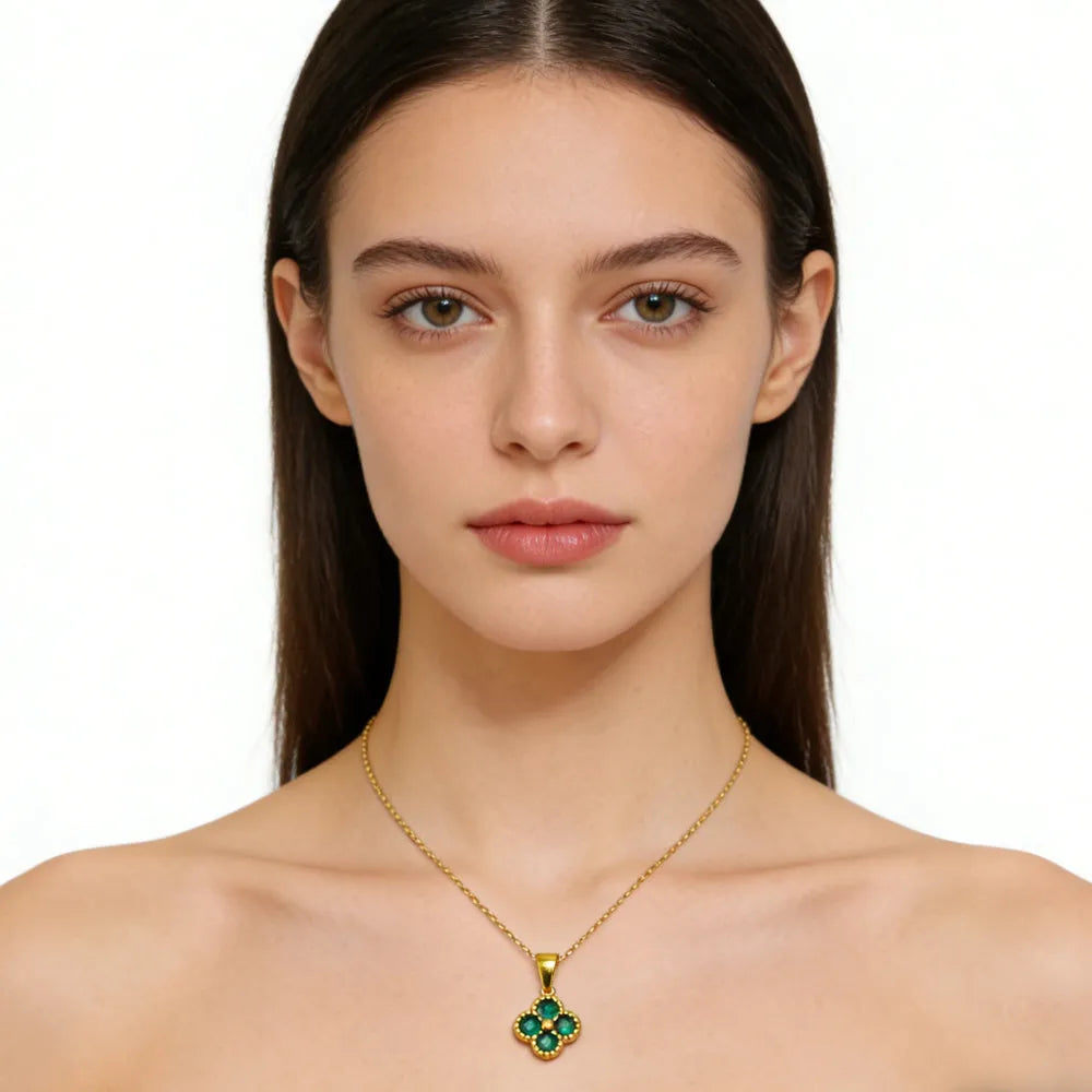 Green 4-leaf clover necklace by Nova Mart featuring a 24K gold lucky pendant on a delicate chain.