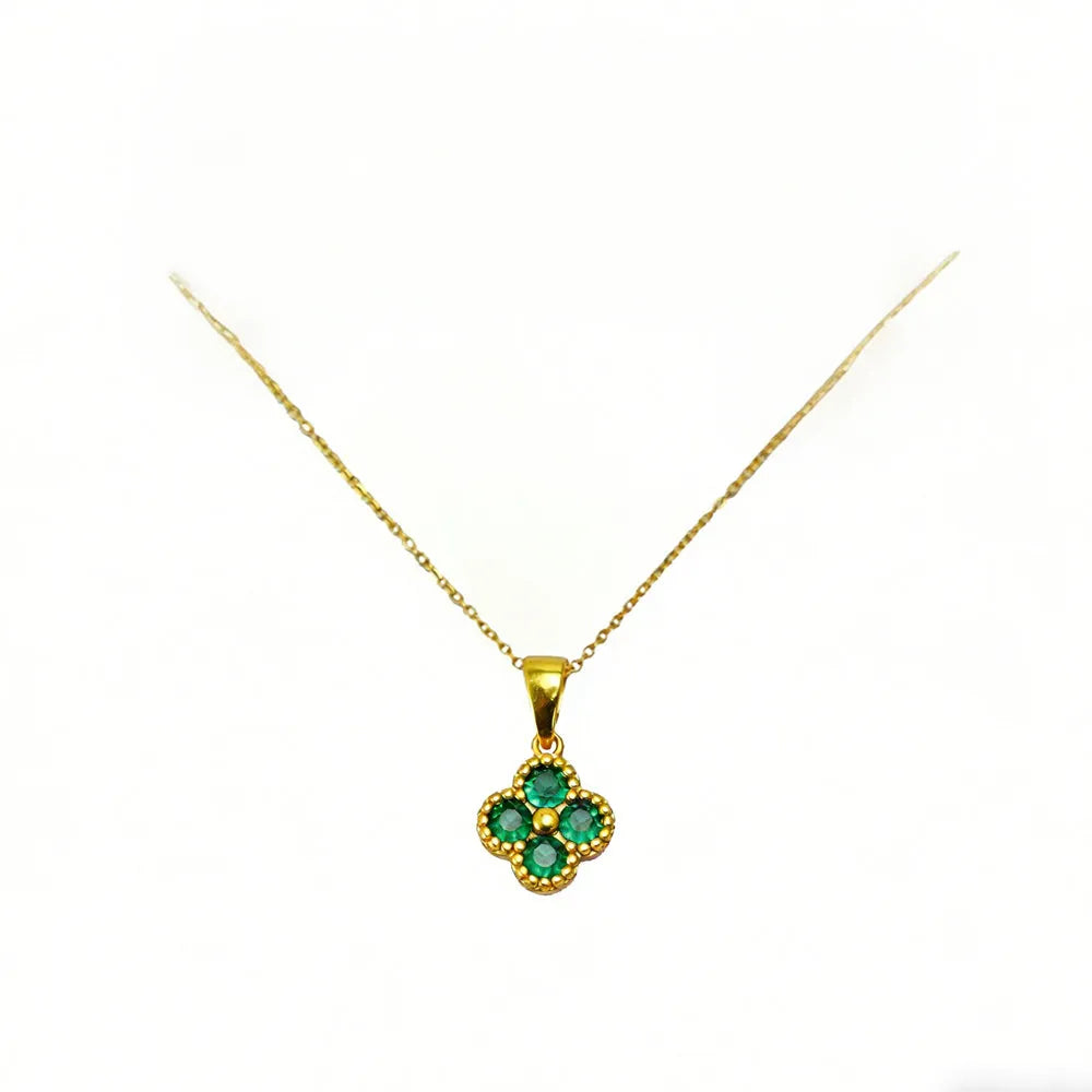 Green 4-leaf clover necklace with a 24K gold pendant, Nova Mart jewelry featuring a lucky charm design.