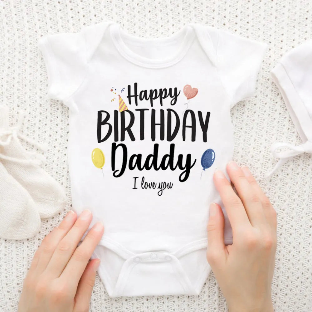 Baby boy in a short sleeve "Happy Birthday Daddy" romper by Nova Mart, cute summer birthday baby clothing.