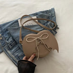 Heart-shaped bag strap design bat wings one-shoulder crossbody bag by Nova Mart, featuring a unique heart and bat wing detail.