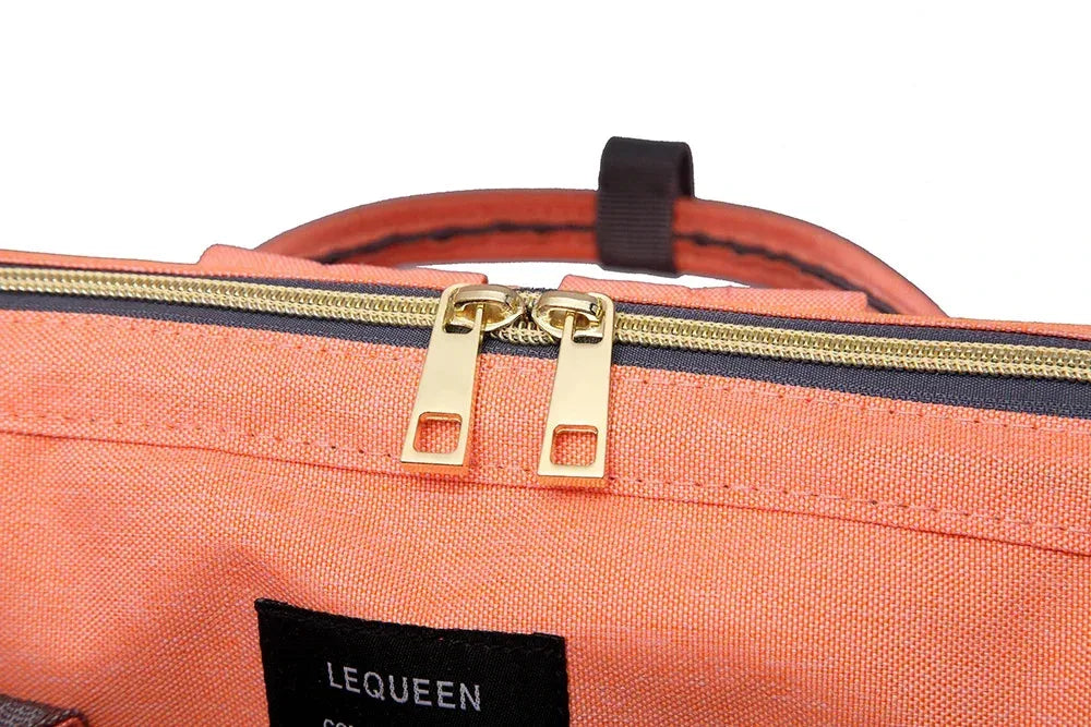 Large capacity Nova Mart Lequeen mummy diaper bag backpack with multiple compartments for travel and baby essentials.