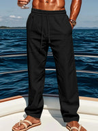 Men's linen blend pants with elastic waist and relaxed fit, casual beach style, by Nova Mart.