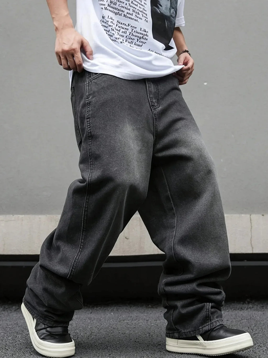 Men's Nova Mart micro flared wide-leg jeans with loose straight fit and pleated denim design, shown in a stylish fashion pose.