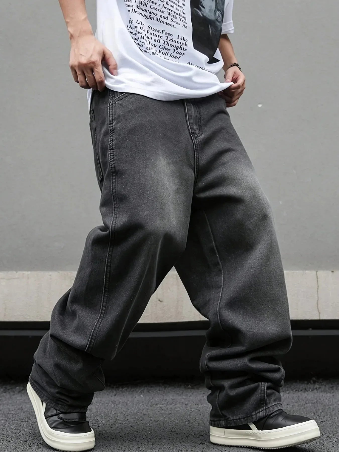 Men's Nova Mart micro flared wide-leg jeans with loose straight fit and pleated denim design, shown in a stylish fashion pose.