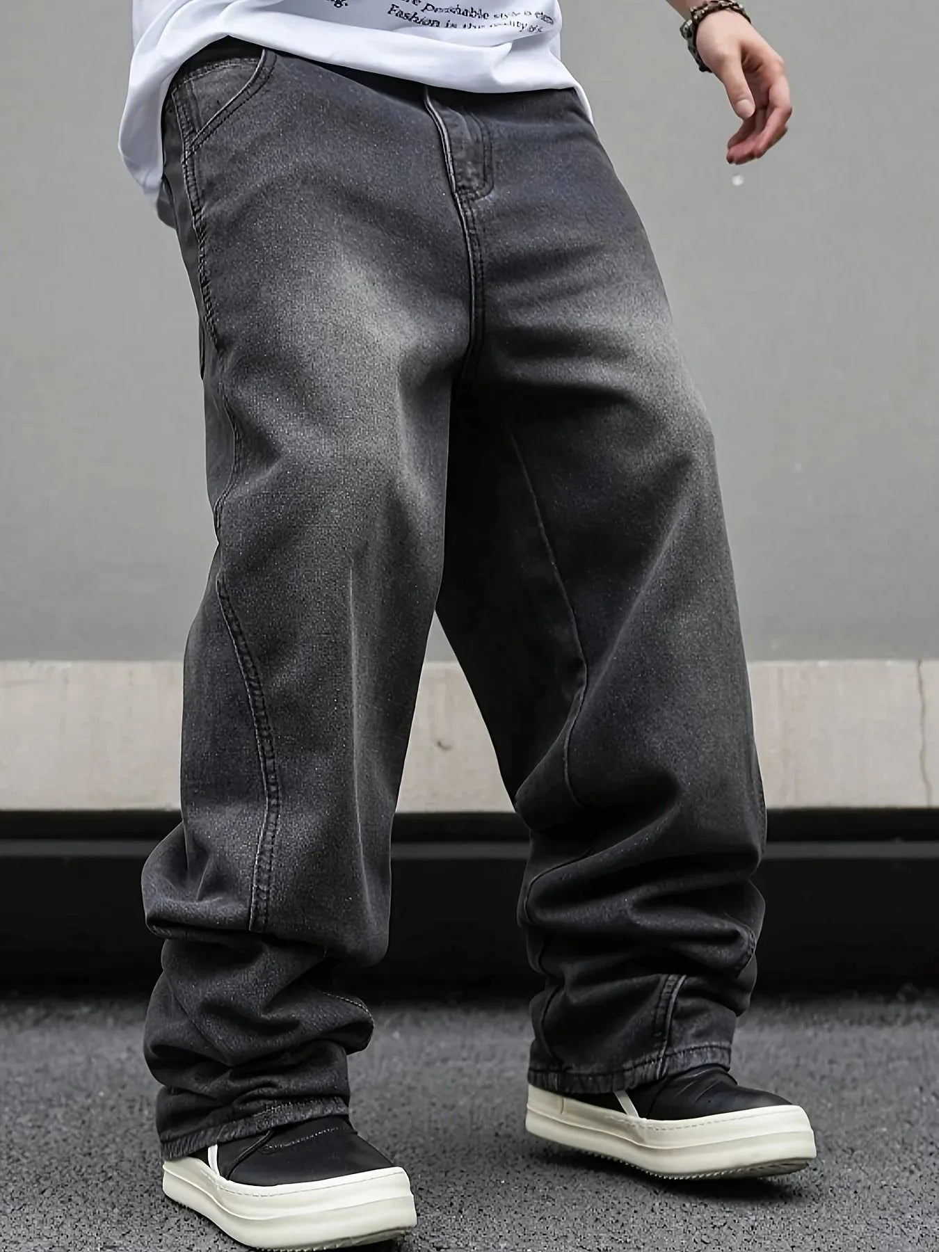 Men's micro flared wide leg jeans by Nova Mart with loose straight fit and pleated denim, shown in a stylish front view.