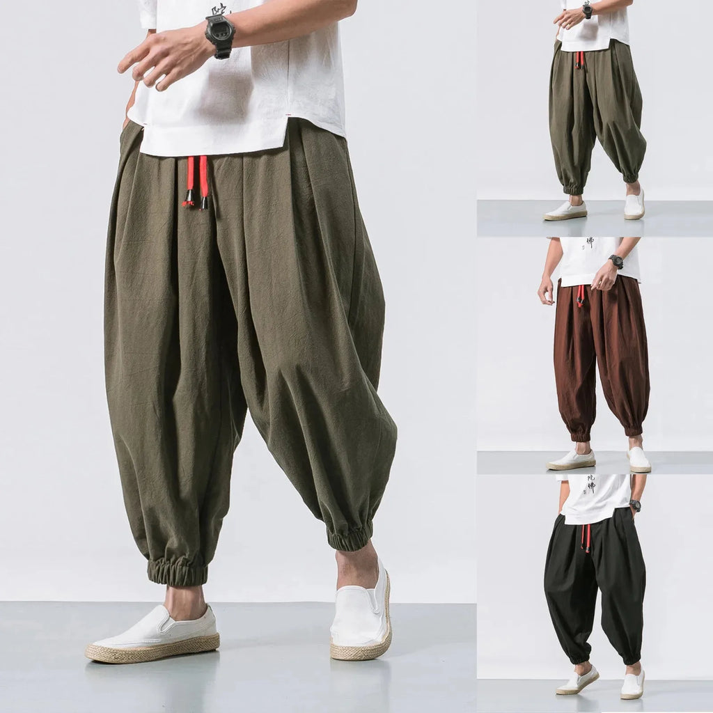 Men's loose linen harem pants by Nova Mart, oversized and relaxed fit, shown in natural linen fabric with a casual style.