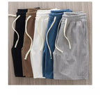 Men's navy waffle texture shorts with loose fit and drawstring waist, ideal for casual summer wear by Nova Mart.