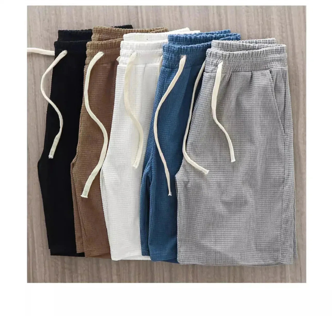 Men's navy waffle texture shorts with loose fit and drawstring waist, ideal for casual summer wear by Nova Mart.