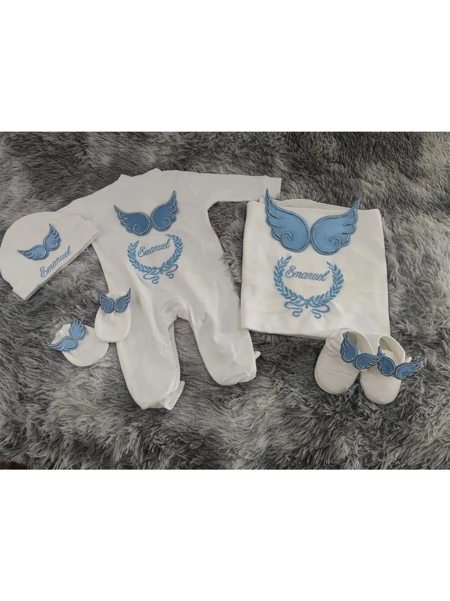White and blue embroidered newborn angel wings outfit set by Nova Mart, soft baby clothing with delicate details.