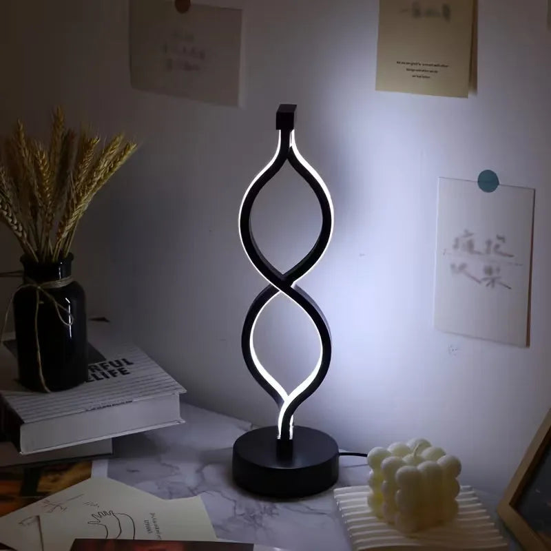 Wave-shaped Nova Mart USB desk lamp with three-color dimmable lighting and wave design, shown on a modern workspace.