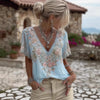Women's 3D print V-neck artistic top by Nova Mart, featuring vibrant 3D floral design and lightweight fabric.