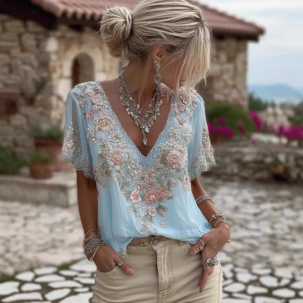 Women's 3D print V-neck artistic top by Nova Mart, featuring vibrant 3D floral design and lightweight fabric.