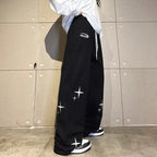 Women's ankle-tied two-purpose sweatpants by Nova Mart showing relaxed fit and tie details at the ankles.