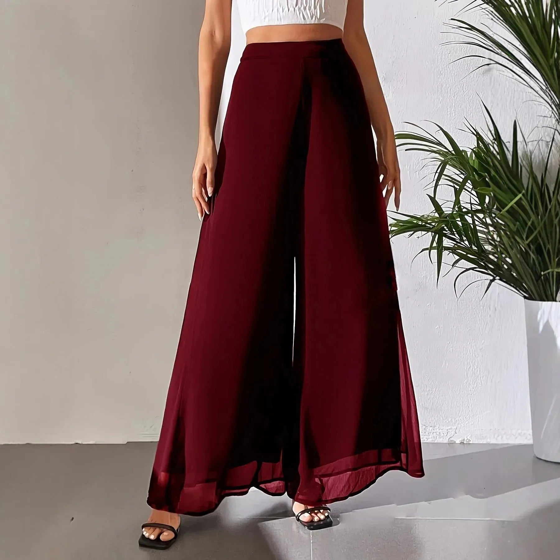 Women's casual chiffon wide-leg loose trousers by Nova Mart, showing flowing fabric and relaxed fit in soft light.