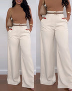 Women's casual solid color flared pants by Nova Mart, showing a relaxed fit and flared design in a neutral tone.