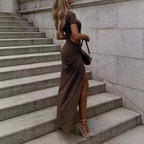 Women's backless wrap dress with cutout detail, crew neck, and elegant design by Nova Mart displayed on a hanger.