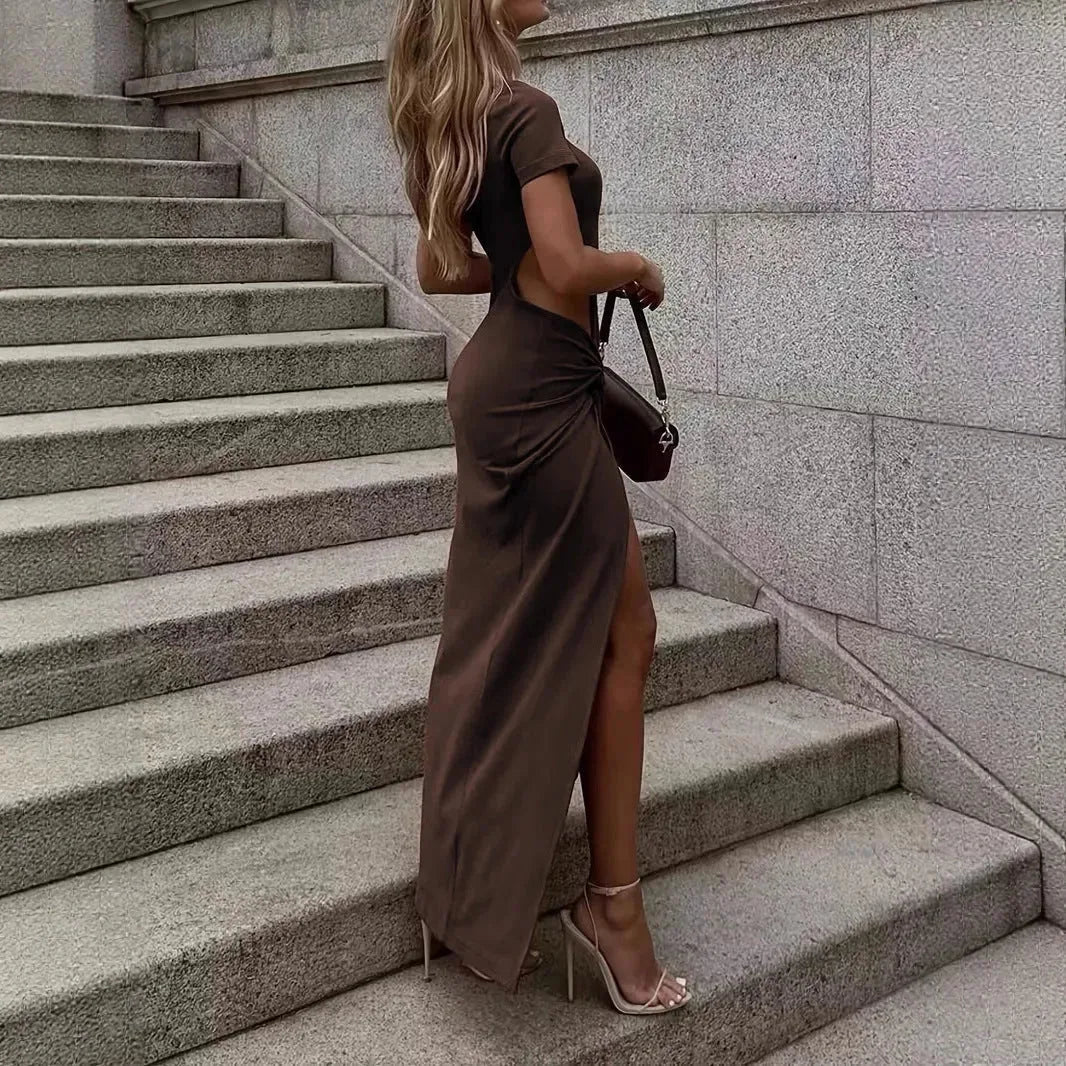 Women's backless wrap dress with cutout detail, crew neck, and elegant design by Nova Mart displayed on a hanger.