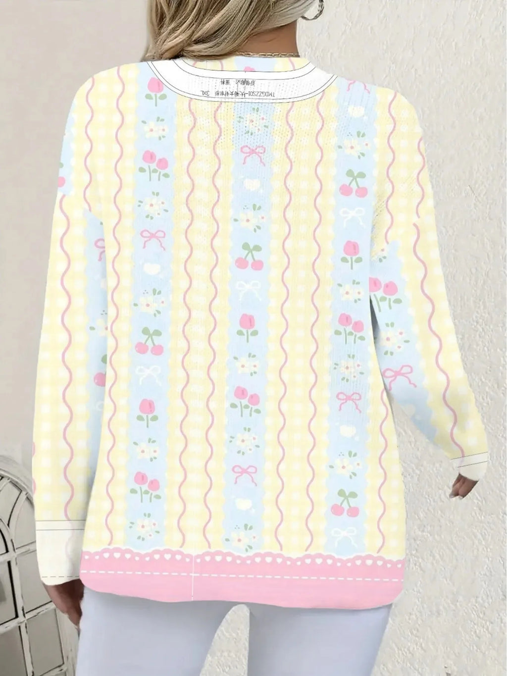 Women's digital print graphic top by Nova Mart featuring vibrant, colorful design and casual fit on a model.