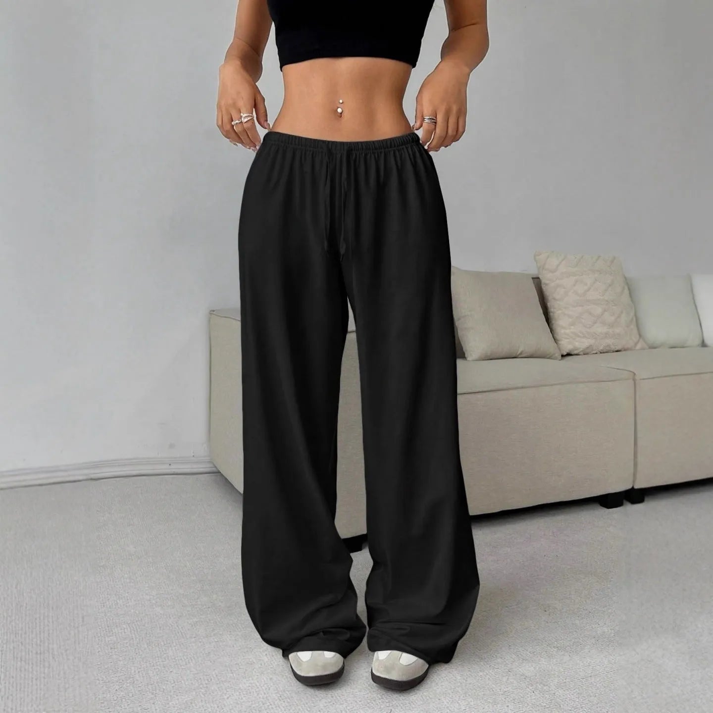 Women's elastic waist lace-up wide-leg casual pants by Nova Mart, shown in a relaxed fit with lace-up detail and flowing fabric.