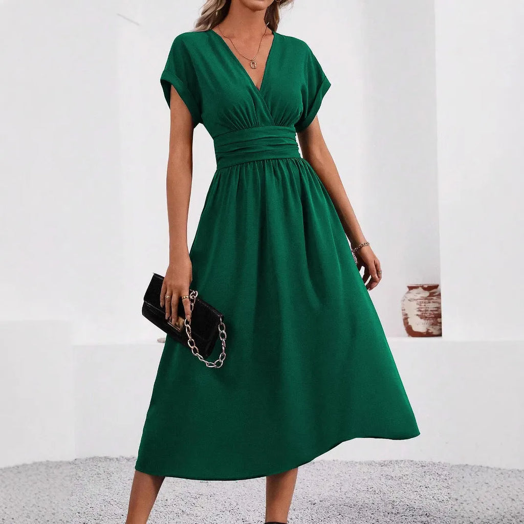 Women's elegant solid-color long dress by Nova Mart, flowing and stylish with a fitted waist and full-length design.