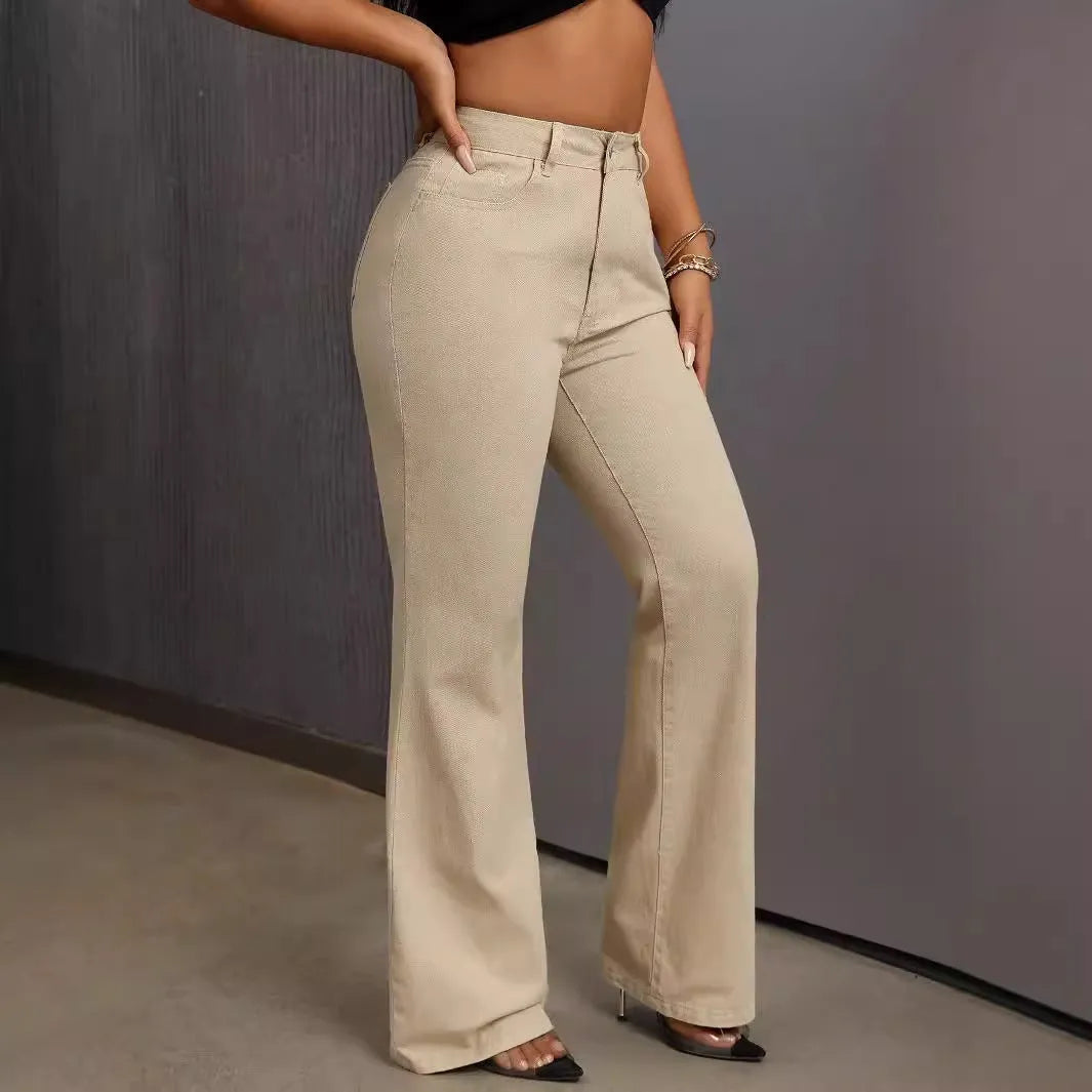 Women's wide leg pull-on jeans by Nova Mart, floor-sweeping style with a relaxed fit and high-rise waist, shown hanging on a rack.
