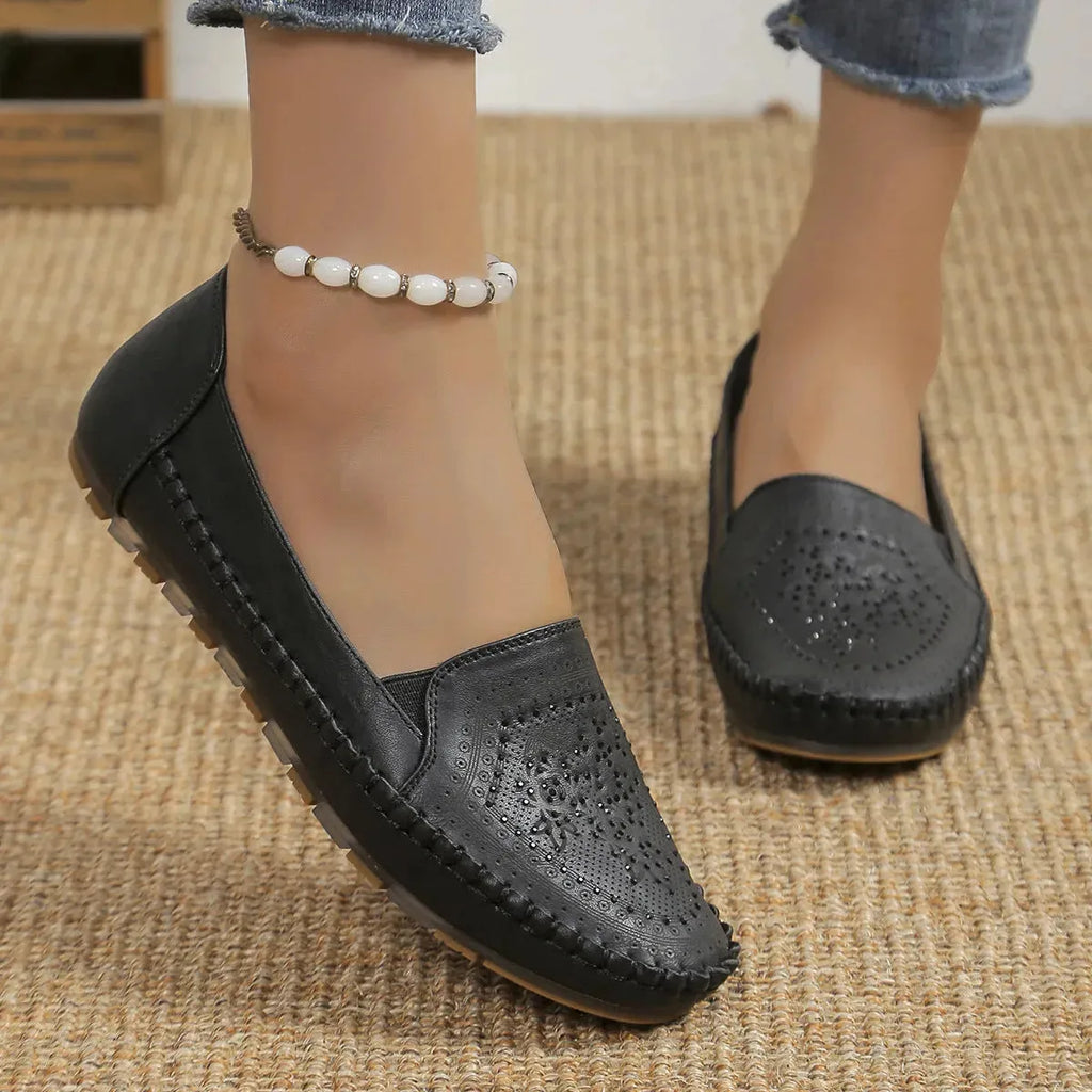 Women's handmade stitching Gommino casual shoes by Nova Mart, featuring soft leather and comfortable slip-on design.