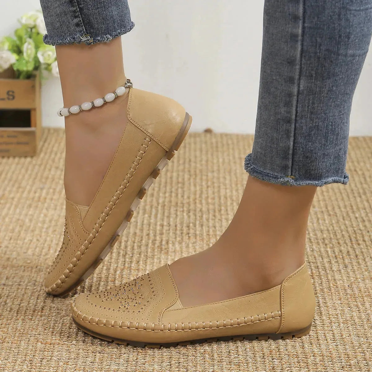 Women's handmade stitching Gommino casual shoes by Nova Mart, featuring soft leather and comfortable slip-on design.