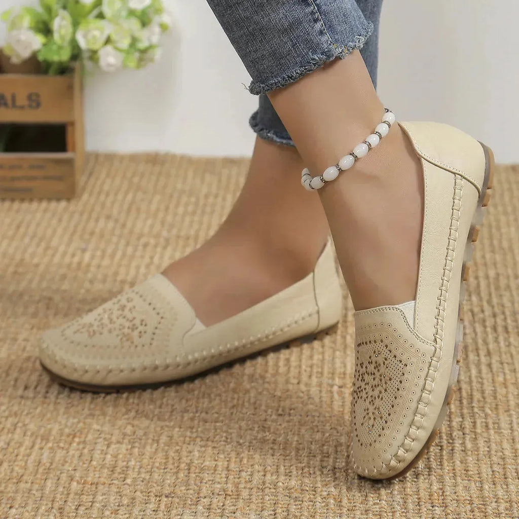 Women's handmade stitching Gommino casual shoes by Nova Mart, featuring soft leather and comfortable slip-on design.