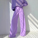 Women's high-waist wide-leg suit pants by Nova Mart, shown in black fabric with tailored fit and flowing wide-leg design.