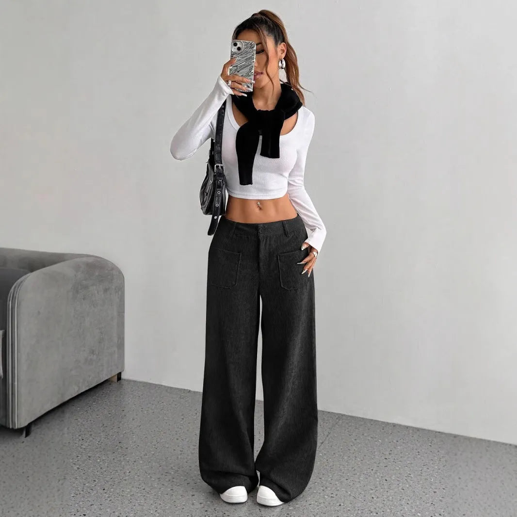 Women's loose fit corduroy wide-leg pants by Nova Mart, showing the relaxed fit and textured fabric in natural light.