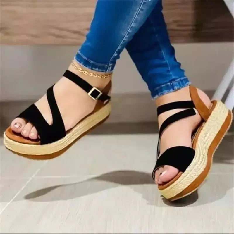 Women's platform sandals with hollow buckle design by Nova Mart, featuring chunky soles and stylish open-toe footwear.
