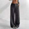 Women's printed plaid pants with pockets, stylish and comfortable pants from Nova Mart, featuring a vibrant plaid pattern.