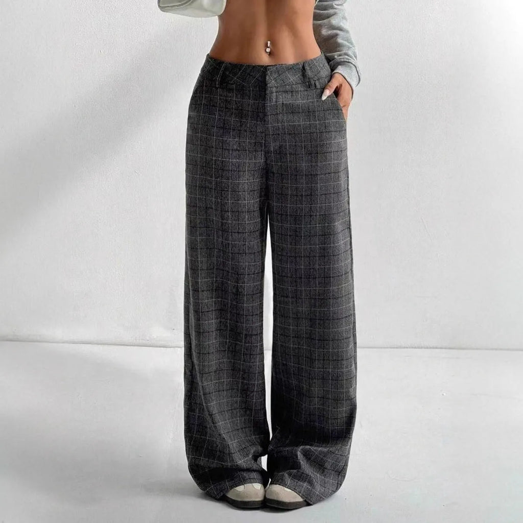 Women's printed plaid pants with pockets, stylish and comfortable pants from Nova Mart, featuring a vibrant plaid pattern.
