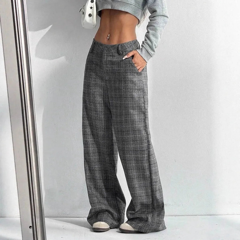 Women's printed plaid pants with pockets by Nova Mart, featuring a stylish pattern and comfortable fit.