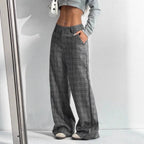 Women's printed plaid pants with pockets by Nova Mart, featuring a stylish pattern and comfortable fit.