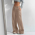 Women's printed plaid pants with pockets from Nova Mart, featuring a stylish checkered design and comfortable fit.