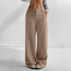 Women's printed plaid pants with pockets by Nova Mart, showing a stylish design and comfortable fit in the image.