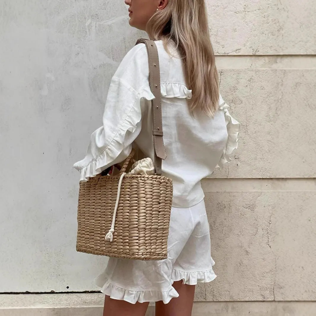 Women's ruffle-trim shorts casual two-piece clothing set by Nova Mart, featuring stylish ruffled shorts and matching top.