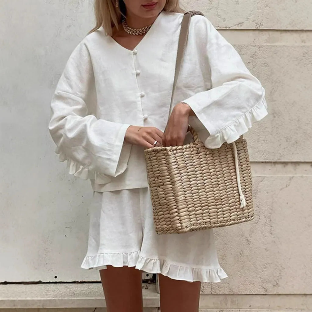 Women's ruffle-trim shorts casual two-piece clothing set by Nova Mart, featuring a stylish top and matching shorts.